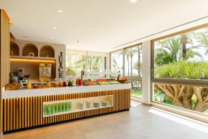 a kitchen with a counter with food on it at THB Los Molinos Adults Only in Ibiza Town