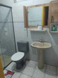 a bathroom with a toilet and a sink at Exclusivo Haras Marilu! in Atibaia +45 photos