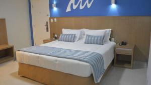 Cama ou camas em um quarto em Real Classic Bahia Hotel