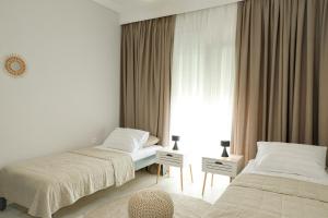 Postel nebo postele na pokoji v ubytování Freya Apartments