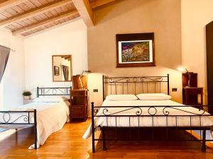 Posteľ alebo postele v izbe v ubytovaní La Casina