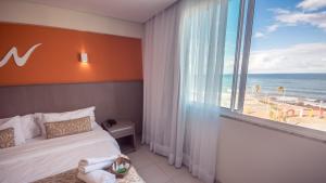 Cama ou camas em um quarto em Real Classic Bahia Hotel