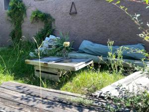 a table with a vase on it in the grass at Urmah in Villa Serrana