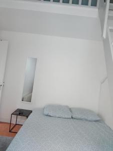 Katil atau katil-katil dalam bilik di Chambre familiale