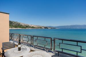 a view of the ocean from a balcony at Hotel Dobrovit in Baška