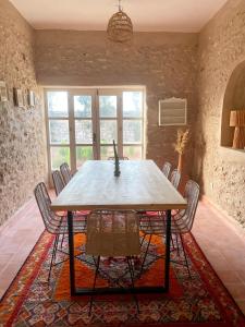 a dining room with a table and chairs at Adam house in Essaouira +33 photos