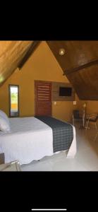 Postel nebo postele na pokoji v ubytování Pousada Recanto Serra Verde + 14 fotografií