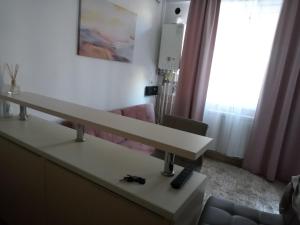 a hospital room with a reception desk and a couch at Casa del Mar in Eforie Nord