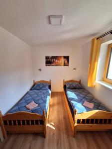Posteľ alebo postele v izbe v ubytovaní Apartmány Horní Bečva