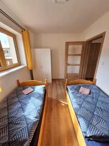 Posteľ alebo postele v izbe v ubytovaní Apartmány Horní Bečva