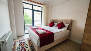 Postel nebo postele na pokoji v ubytování Cappadocia Ürgüp Apart Hotel