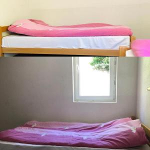 two bunk beds in a room with a window at Villa Malesia in Peje +12 photos