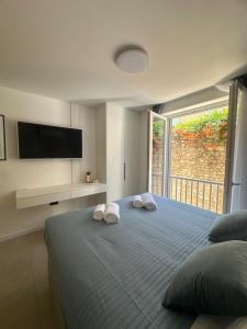 Ένα ή περισσότερα κρεβάτια σε δωμάτιο στο Amaro Luxury Room & Studio Apartman with Balcony