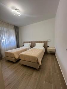 Ένα ή περισσότερα κρεβάτια σε δωμάτιο στο Residenza Zotaj appartamento due