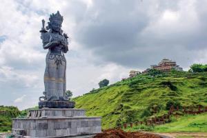 a statue of a woman standing on top of a hill at Kathmandu Family Home in Kirtipur