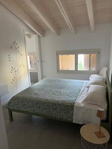 Postel nebo postele na pokoji v ubytování Le Casette B - Camera con bagno