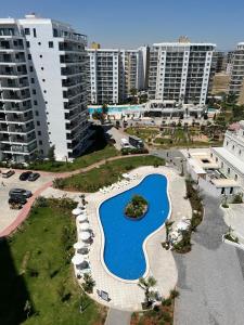 an aerial view of a swimming pool in a city at Studio Alev POOLview-CaesarResortSpa(North Cyprus) in Perivolia tou Trikomou