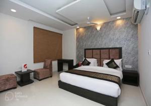 Postel nebo postele na pokoji v ubytování Hotel Syam Baba