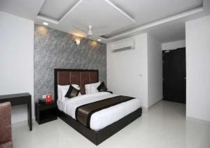 Postel nebo postele na pokoji v ubytování Hotel Syam Baba