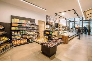 a grocery store aisle with a lot of products at Camping Passeier Glamping Rubinia in Saltusio