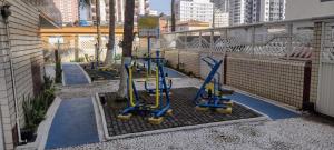 a group of blue scooters parked on a balcony at Apartamento do Simão in Praia Grande