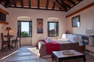 Postel nebo postele na pokoji v ubytování Byzantino Boutique Hotel
