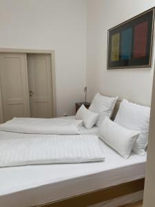 Ένα ή περισσότερα κρεβάτια σε δωμάτιο στο Salzburg-Altstadt-Apartement