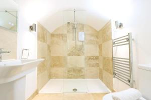 a bathroom with a shower and a sink at Spacious Boutique Apartment Clifton King Size Bed in Bristol