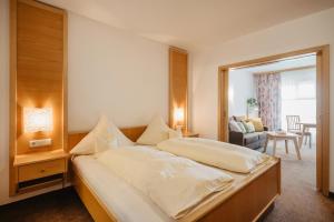 Giường trong phòng chung tại Appartementhaus Achmannhof