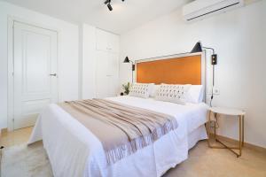 Posteľ alebo postele v izbe v ubytovaní iloftmalaga Calle Nueva 28