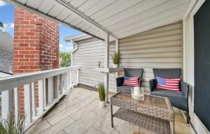 a patio with two chairs and a table at 122 Thirty Third Street in Newport Beach