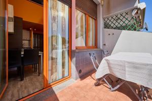 a kitchen and dining room with a table and chairs at San Vincenzo San Luigi 261 in San Vincenzo