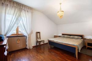 Postel nebo postele na pokoji v ubytování Casa Lella Clemy