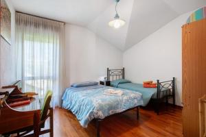 Postel nebo postele na pokoji v ubytování Casa Lella Clemy