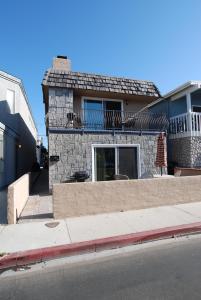 a house on the side of a street at 124 Thirty Fourth Street B in Newport Beach