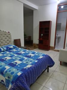 Ένα ή περισσότερα κρεβάτια σε δωμάτιο στο Departamento Amoblado +8 φωτογραφίες