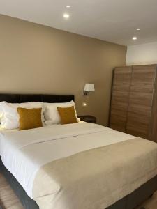 Postel nebo postele na pokoji v ubytování AppartHôtel Elite Spa