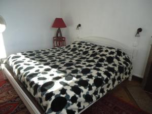 Ένα ή περισσότερα κρεβάτια σε δωμάτιο στο chambre d'hôte dans maison privée
