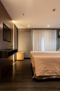 Postel nebo postele na pokoji v ubytování Suíte Grand Luxo Brasília