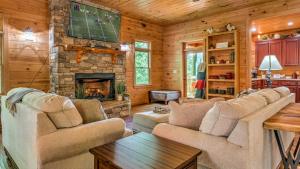a living room with a couch and a fireplace at Memory Maker in Blue Ridge