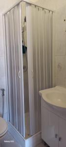 a bathroom with a shower and a toilet and a sink at Trulli & Case Fichi 3 in Bari +52 photos