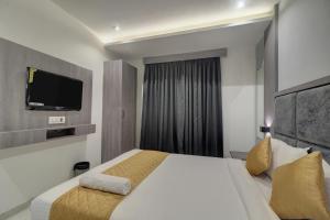 Postel nebo postele na pokoji v ubytování Hotel Isra International, BKC