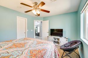 a bedroom with a bed and a ceiling fan at Tucson Home with Patio, Grill and Mountain Views! in Tucson