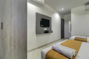 Postel nebo postele na pokoji v ubytování Hotel Isra International, BKC