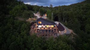 a large house in the middle of a forest at Long View Resort Bryson City, NC in Bryson City