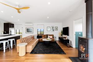 a living room with a couch and a table at Dream Vacation Home 3 Bdr 2 Ba in Cape Woolamai
