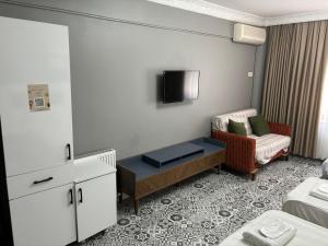 A television and/or entertainment centre at Mara Suite Taxim