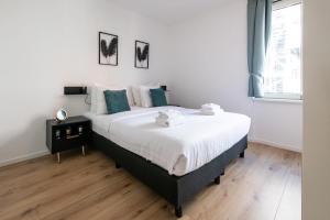 Katil atau katil-katil dalam bilik di Aparthotel North Spacious Suite for 6 Guests