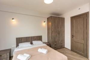 Giường trong phòng chung tại 1BR Apartment in Twins Gudauri project