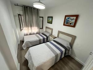 Postel nebo postele na pokoji v ubytování Apartamentos Calypso Altamar